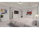 Spacious main bedroom suite with a tray ceiling, a television, and neutral decor at 9353 Middle Fork St, Littleton, CO 80125