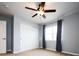 Bedroom with double door closet and window with curtains at 7924 Florado St, Denver, CO 80221