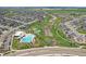 Expansive aerial view of the community with a pool, tennis courts, walking trails, and modern homes at 5226 Inland Ave, Firestone, CO 80504