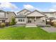 Expansive backyard featuring lush grass, a covered patio and small garden. Ideal for outdoor living and entertaining at 5226 Inland Ave, Firestone, CO 80504
