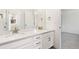 Bathroom vanity with double sinks, quartz countertop, and modern fixtures at 5226 Inland Ave, Firestone, CO 80504
