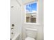 Bright bathroom with a shower/tub combo and modern fixtures at 5226 Inland Ave, Firestone, CO 80504