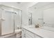 Bathroom featuring a glass-enclosed shower and quartz countertops at 5226 Inland Ave, Firestone, CO 80504