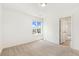 Bright bedroom with plush carpet and a large window for natural light at 5226 Inland Ave, Firestone, CO 80504