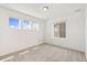 Bright bedroom featuring multiple windows for plenty of natural light at 5226 Inland Ave, Firestone, CO 80504