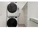 Convenient laundry area with stacked washer and dryer, and ample storage space at 5226 Inland Ave, Firestone, CO 80504