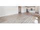 Open-concept living room with hardwood floors, and abundant natural light at 5226 Inland Ave, Firestone, CO 80504