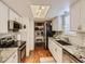 Bright kitchen with white cabinetry, granite countertops, and stainless steel appliances at 11275 Holly St, Thornton, CO 80233