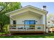 The back deck has seating and looks over the grassy backyard at 13905 Berry Rd, Golden, CO 80401