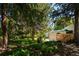 Lush backyard with patio, deck and shady trees, offering a serene outdoor escape at 13905 Berry Rd, Golden, CO 80401