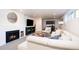 Inviting basement living space with a cozy fireplace and comfortable seating area at 13905 Berry Rd, Golden, CO 80401