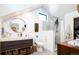 Well-lit bathroom featuring a vanity with marble countertop and glass shower at 13905 Berry Rd, Golden, CO 80401