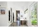Bright bathroom featuring a soaking tub, unique mirror, and access to a walk-in closet and exterior entrance at 13905 Berry Rd, Golden, CO 80401