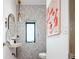 Contemporary powder room featuring unique stone countertop and modern fixtures and hardware at 13905 Berry Rd, Golden, CO 80401