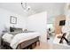 Cozy bedroom featuring ample light, hardwood floors, and contemporary decor at 13905 Berry Rd, Golden, CO 80401