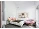 Cozy bedroom with whimsical decor, carpet, and a bright window at 13905 Berry Rd, Golden, CO 80401