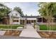 Stunning modern home with a walkway leading to the front door and professionally landscaped yard at 13905 Berry Rd, Golden, CO 80401