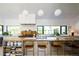 Bright, modern kitchen with a large island, wooden countertops, and stainless steel appliances at 13905 Berry Rd, Golden, CO 80401