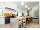 Bright gourmet kitchen with a large island, stainless steel appliances, and hardwood floors at 13905 Berry Rd, Golden, CO 80401