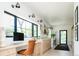 Bright laundry room featuring a built-in desk, modern washer and dryer, and stylish decor and art at 13905 Berry Rd, Golden, CO 80401