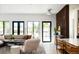 Bright and airy living room featuring modern furnishings, large windows, and hardwood floors at 13905 Berry Rd, Golden, CO 80401