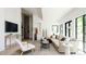 Open-concept living room showcasing modern design, comfortable seating, and a convenient wet bar at 13905 Berry Rd, Golden, CO 80401