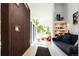Bright, open living room with hardwood floors and a cozy seating area with a large plant at 13905 Berry Rd, Golden, CO 80401