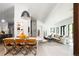 Bright open-concept living and dining room with light wood floors and sleek, modern finishes at 13905 Berry Rd, Golden, CO 80401