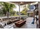 Relaxing outdoor space with swing chairs, plush pillows, and a modern fire pit at 13905 Berry Rd, Golden, CO 80401