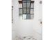 Bright shower with a rain shower head, built-in seating, and a large window for natural light at 13905 Berry Rd, Golden, CO 80401