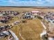 Aerial view of property and surrounding park-like area at 334 Feather Pl, Lochbuie, CO 80603