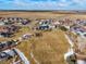 Aerial view of property and surrounding park-like area at 334 Feather Pl, Lochbuie, CO 80603