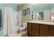 Clean bathroom with tub shower, vanity, and mirror at 334 Feather Pl, Lochbuie, CO 80603