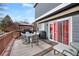 Spacious deck with table, chairs, and grill; perfect for outdoor dining and entertaining at 3836 Garnet Way, Highlands Ranch, CO 80126