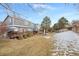 Spacious backyard, partially covered in snow, with deck and gazebo at 3836 Garnet Way, Highlands Ranch, CO 80126