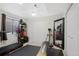 Home gym with treadmill, weights, and mirror at 3836 Garnet Way, Highlands Ranch, CO 80126