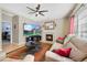 Relaxing living room with fireplace, large TV, and comfortable seating at 3836 Garnet Way, Highlands Ranch, CO 80126