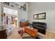 Two-story living room with hardwood floors, high ceilings and a view of the kitchen at 3836 Garnet Way, Highlands Ranch, CO 80126