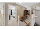 Upstairs hallway with built-in shelving and bedroom access at 3836 Garnet Way, Highlands Ranch, CO 80126