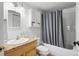 Bathroom featuring a shower with curtain and a light wood vanity at 4185 Red Rock Dr, Larkspur, CO 80118