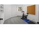 Bedroom with exercise equipment, light-colored walls and gray carpet at 4185 Red Rock Dr, Larkspur, CO 80118