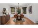 Dining area features updated lighting, natural light, and seating for four at 4185 Red Rock Dr, Larkspur, CO 80118