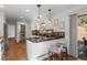 Bright kitchen features a breakfast bar with granite counters and views of the outdoor space at 4185 Red Rock Dr, Larkspur, CO 80118