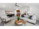Open-concept living room with vaulted ceilings, a dining area, and comfortable seating at 4185 Red Rock Dr, Larkspur, CO 80118