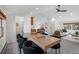 Open floor plan with a dining table and chairs in the foreground and a living room in the background at 4185 Red Rock Dr, Larkspur, CO 80118
