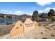 Entrance to Perry Park Country Club with its stone sign showing timeless beauty and amazing golf at 4185 Red Rock Dr, Larkspur, CO 80118