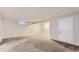 Spacious finished basement with neutral carpet, recessed lighting and ample storage space at 925 Wolff St, Denver, CO 80204