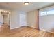 Bright bedroom with hardwood floors, double door closet and large window with drapes at 925 Wolff St, Denver, CO 80204