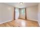 Bright bedroom with hardwood floors, neutral paint, and windows bringing in natural light at 925 Wolff St, Denver, CO 80204