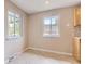 Cozy dining area features tile flooring, neutral paint and a sunny window with backyard views at 925 Wolff St, Denver, CO 80204